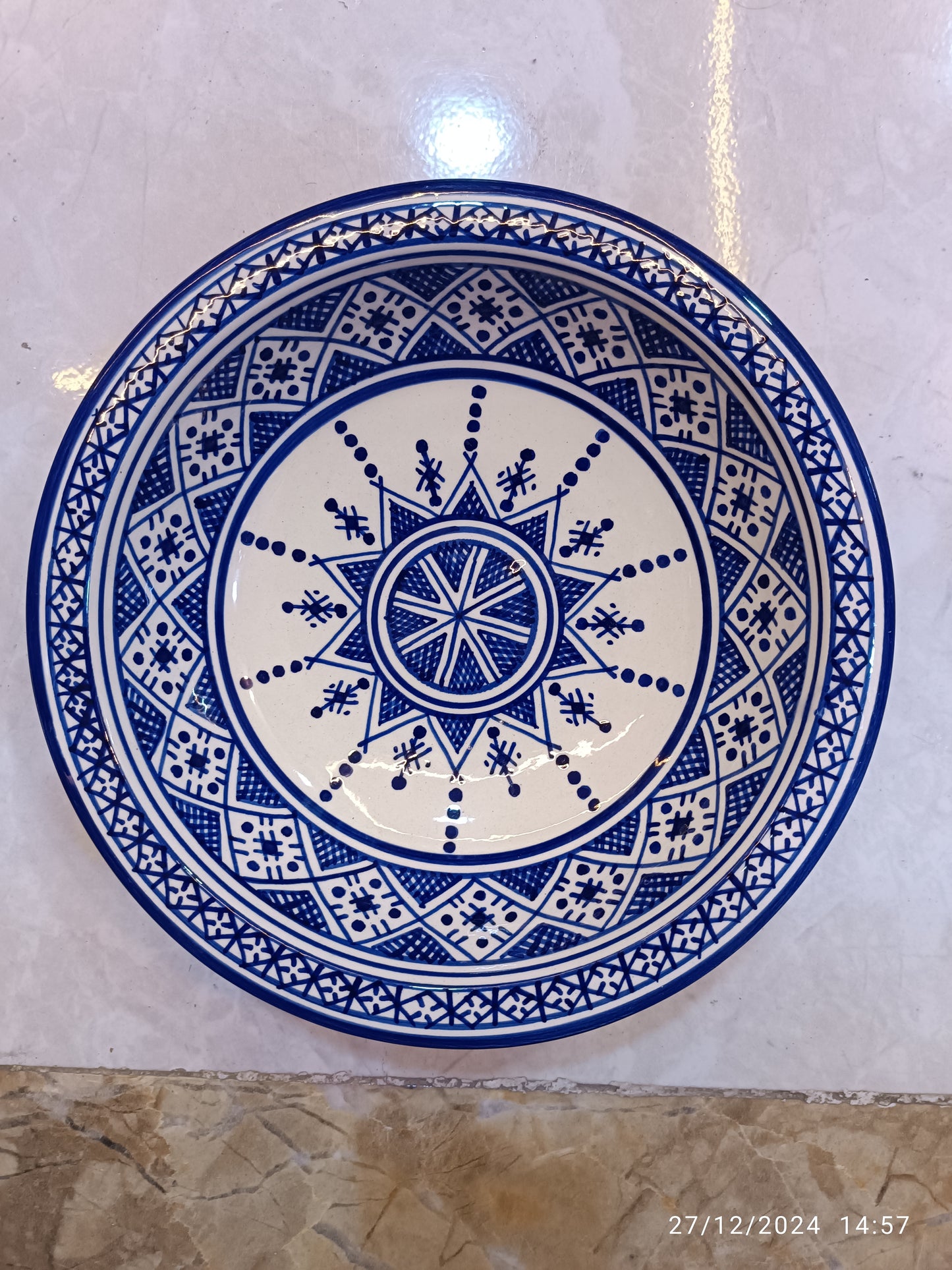Serving plates made of white clay, hand-painted and hand-decorated.