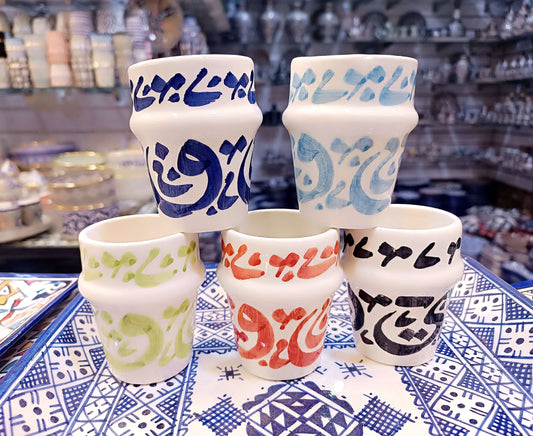 5 cups hand painted dishwasher safe cups with Arabic calligraphy in blue, green, red, and orange on a decorative tray.