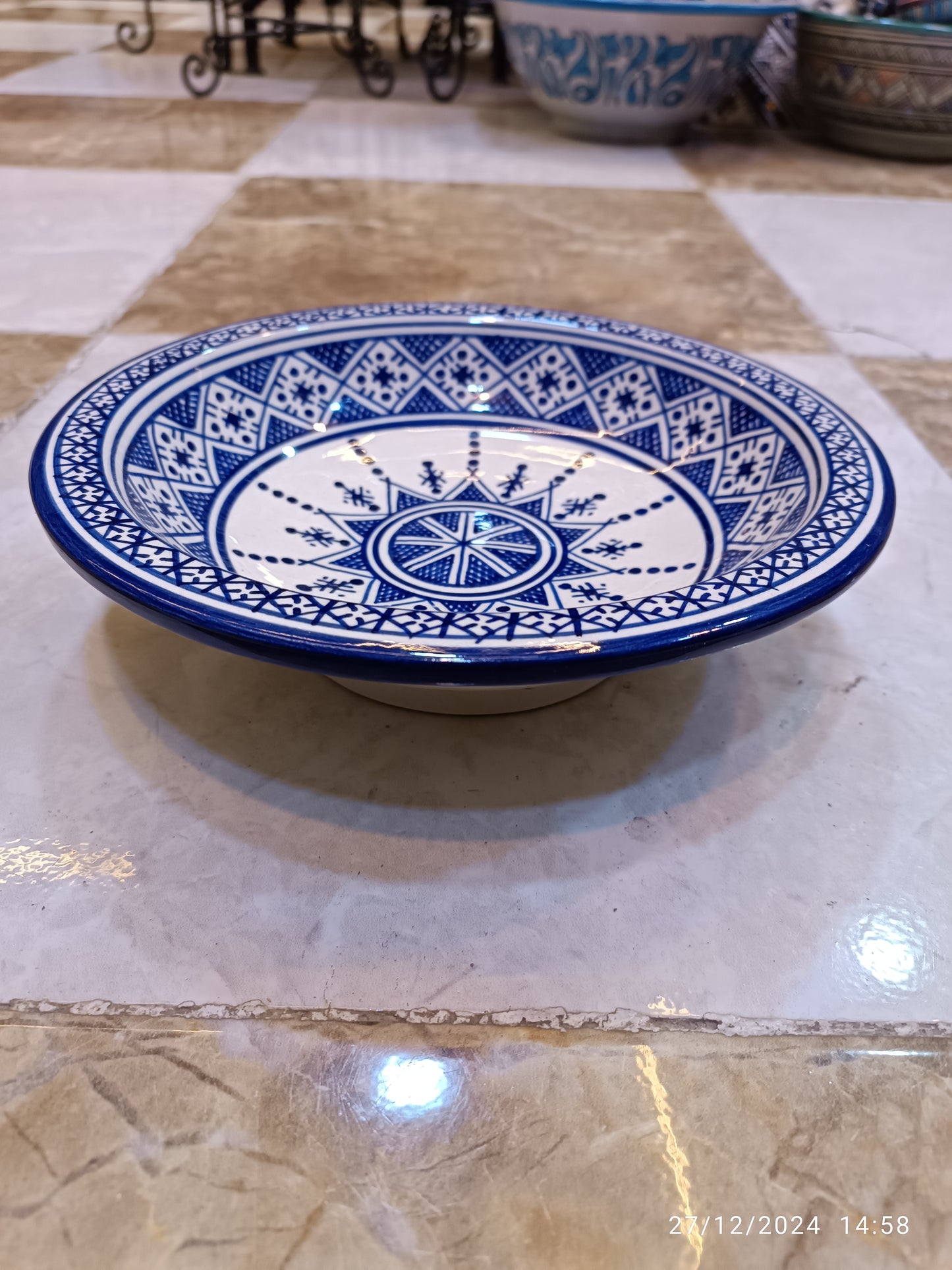 Serving plates made of white clay, hand-painted and hand-decorated.