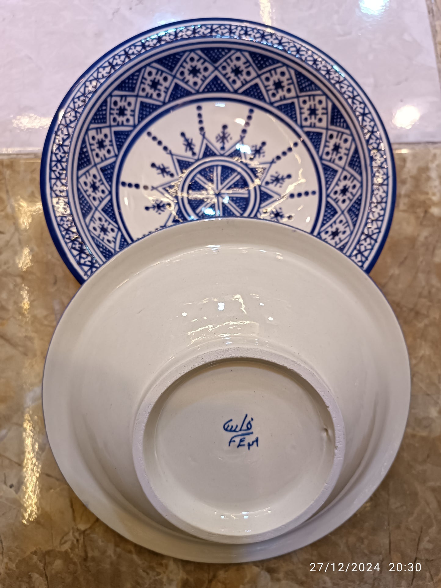 Serving plates made of white clay, hand-painted and hand-decorated.