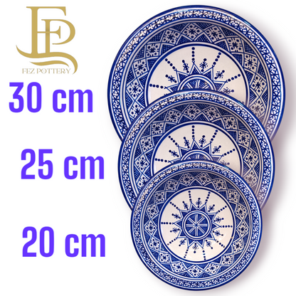 Serving plates made of white clay, hand-painted and hand-decorated.
